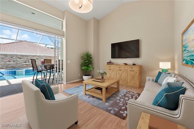 1435 Vintage Ln, Naples, FL 34104 - living area featuring high vaulted ceiling and wood finished floors
