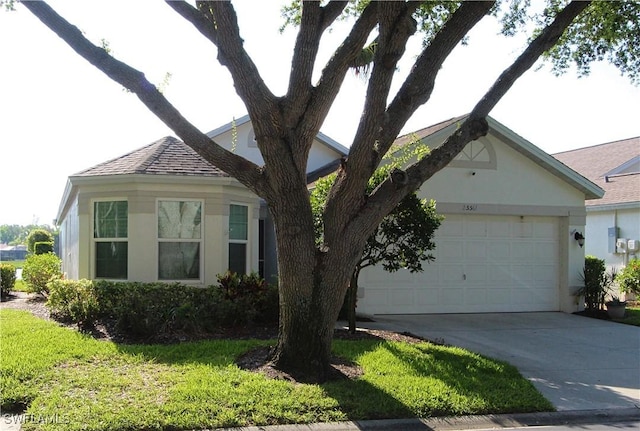 25561 Fairway Dunes Ct, Bonita Springs, FL 34135 - view of front of house featuring stucco siding, driveway, a garage, and a shingled roof