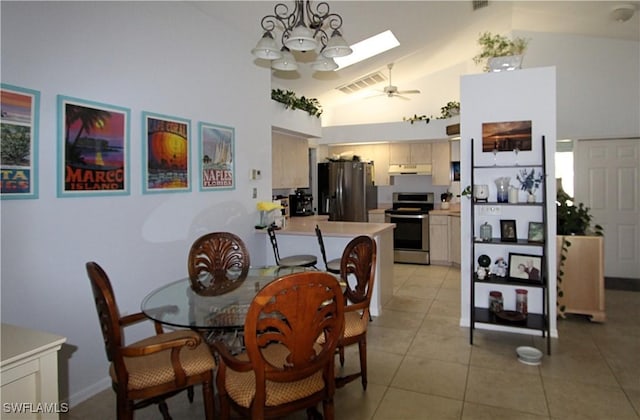 25561 Fairway Dunes Ct, Bonita Springs, FL 34135 - dining room with high vaulted ceiling, a skylight, light tile patterned floors, ceiling fan, and a chandelier