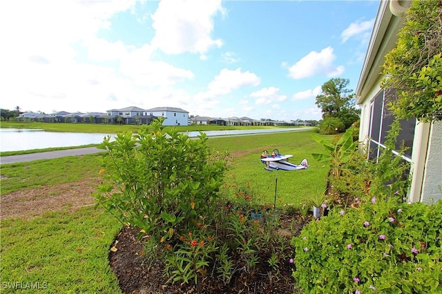 25561 Fairway Dunes Ct, Bonita Springs, FL 34135 - view of grassy yard featuring a water view and a residential view