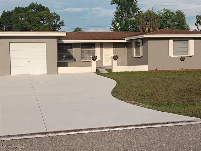 2244 Parkview Dr, Fort Myers, FL 33905 - ranch-style house featuring driveway, stucco siding, a front yard, and a garage