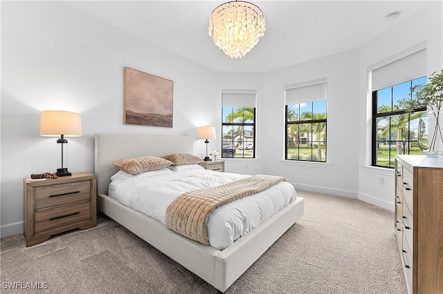 20190 Hartford Blvd, Estero, FL 33928 - bedroom with light colored carpet, a chandelier, and baseboards
