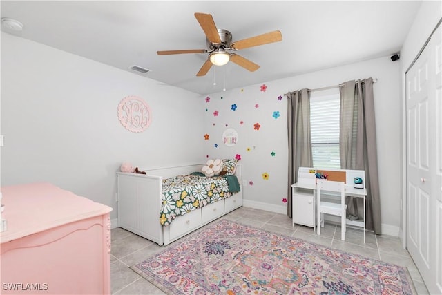 14121 Roof St, Fort Myers, FL 33905 - bedroom with light tile patterned floors, a closet, a ceiling fan, and baseboards