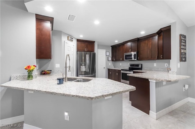 14121 Roof St, Fort Myers, FL 33905 - kitchen featuring stainless steel appliances, a peninsula, a sink, baseboards, and recessed lighting