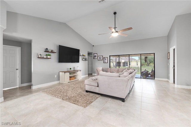 14121 Roof St, Fort Myers, FL 33905 - living area with ceiling fan, baseboards, light tile patterned floors, and high vaulted ceiling
