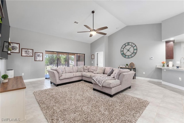 14121 Roof St, Fort Myers, FL 33905 - living area featuring high vaulted ceiling, ceiling fan, light tile patterned floors, and baseboards