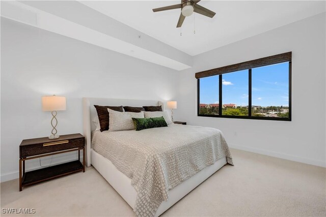 1115 Central Ave Unit 547, Naples, FL 34102 - bedroom featuring light carpet, baseboards, and ceiling fan