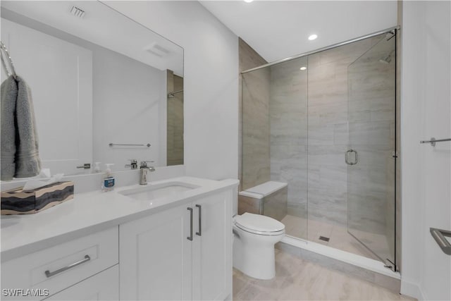 1115 Central Ave Unit 547, Naples, FL 34102 - bathroom featuring vanity, toilet, a stall shower, and recessed lighting