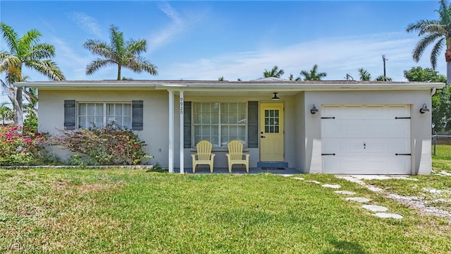 9920 Almetta Ave, Fort Myers, FL 33919 - ranch-style house with stucco siding, a front yard, a garage, and covered porch