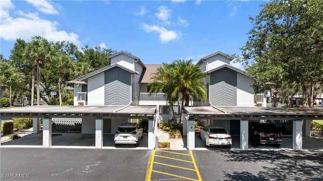 17451 Overhill Dr Unit F, Fort Myers, FL 33908 - view of building exterior with covered parking