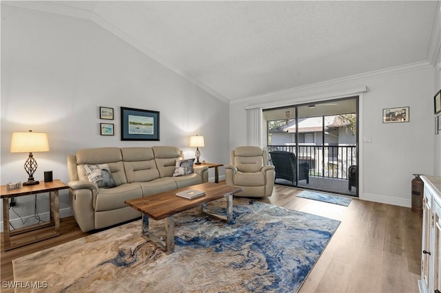 17451 Overhill Dr Unit F, Fort Myers, FL 33908 - living room featuring lofted ceiling, baseboards, wood finished floors, and ornamental molding
