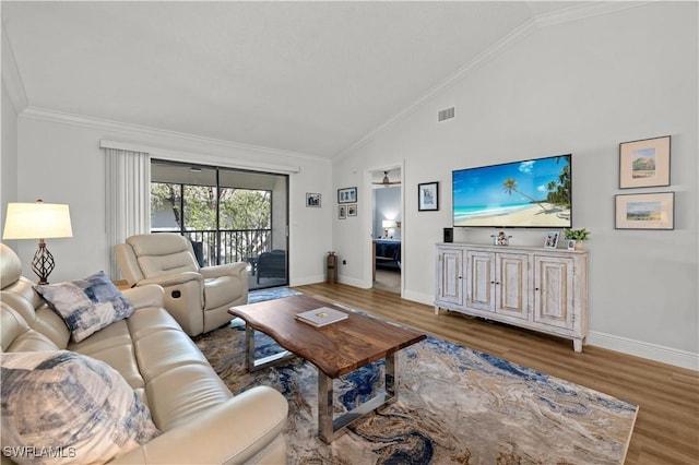 17451 Overhill Dr Unit F, Fort Myers, FL 33908 - living room with wood finished floors, baseboards, ornamental molding, and high vaulted ceiling