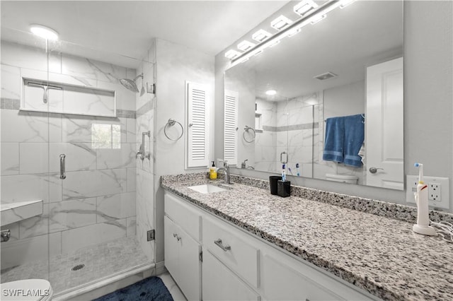 17451 Overhill Dr Unit F, Fort Myers, FL 33908 - bathroom featuring toilet, vanity, and a marble finish shower