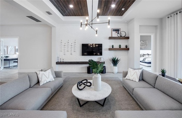 1825 Verada Ct, Naples, FL 34120 - living room featuring a chandelier and wood finished floors