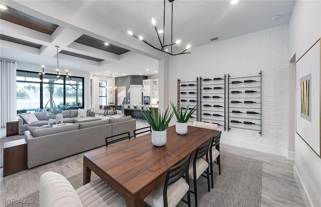 1825 Verada Ct, Naples, FL 34120 - dining area featuring a chandelier, coffered ceiling, beam ceiling, light wood finished floors, and baseboards