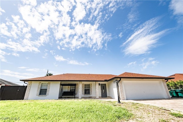 4924 20th Pl SW, Naples, FL 34116 - ranch-style home with an attached garage, a front lawn, stucco siding, and driveway