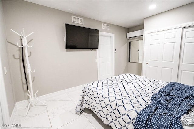 4924 20th Pl SW, Naples, FL 34116 - bedroom with a wall unit AC, a closet, light marble finish floors, and baseboards
