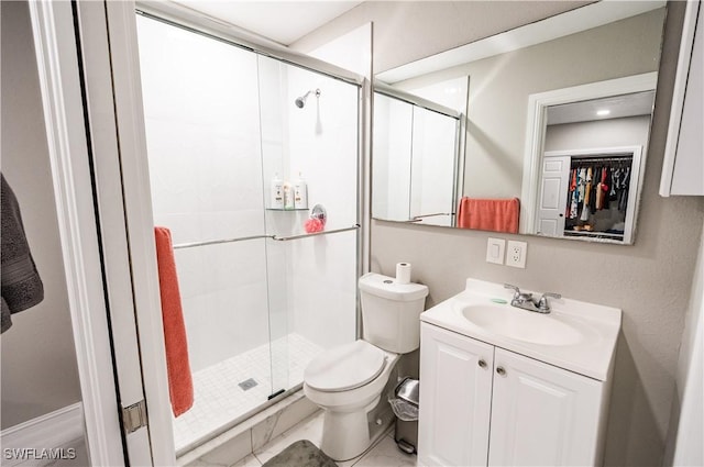 4924 20th Pl SW, Naples, FL 34116 - full bath featuring a shower stall, vanity, toilet, and a walk in closet