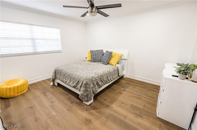 4924 20th Pl SW, Naples, FL 34116 - bedroom with baseboards, ornamental molding, wood finished floors, and a ceiling fan