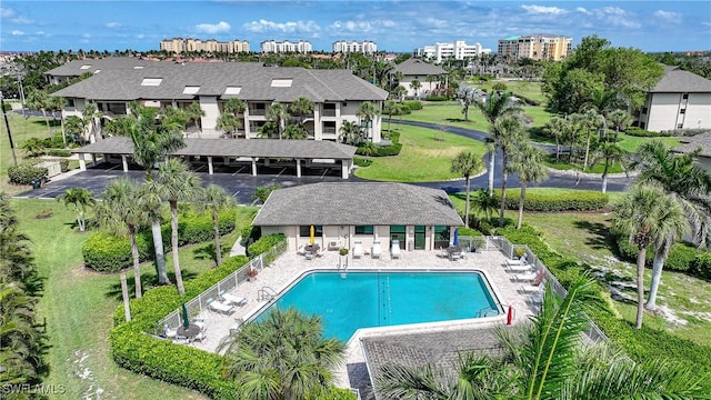 2 Pirates Ln Unit 24B, Punta Gorda, FL 33955 - rear view of property with a community pool and a patio