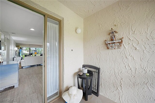 2 Pirates Ln Unit 24B, Punta Gorda, FL 33955 - detailed view of a textured wall, wood finished floors, and recessed lighting
