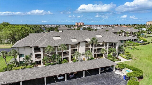 2 Pirates Ln Unit 24B, Punta Gorda, FL 33955 - view of property featuring covered and uncovered parking