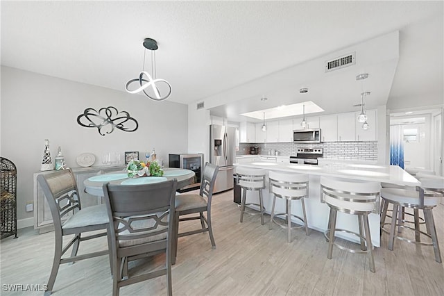 2 Pirates Ln Unit 24B, Punta Gorda, FL 33955 - dining space with light wood-style flooring