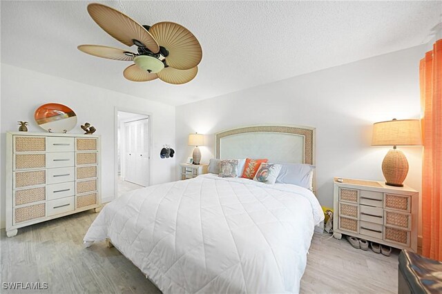 2 Pirates Ln Unit 24B, Punta Gorda, FL 33955 - bedroom with wood finished floors and a ceiling fan