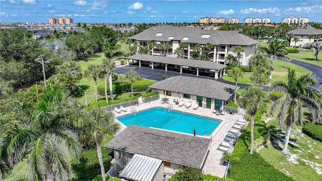 2 Pirates Ln Unit 24B, Punta Gorda, FL 33955 - back of house featuring a community pool and a patio area
