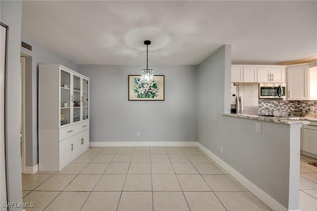 1464 Park Shore Cir Unit 2, Fort Myers, FL 33901 - kitchen with appliances with stainless steel finishes, decorative backsplash, white cabinetry, glass insert cabinets, and light tile patterned flooring
