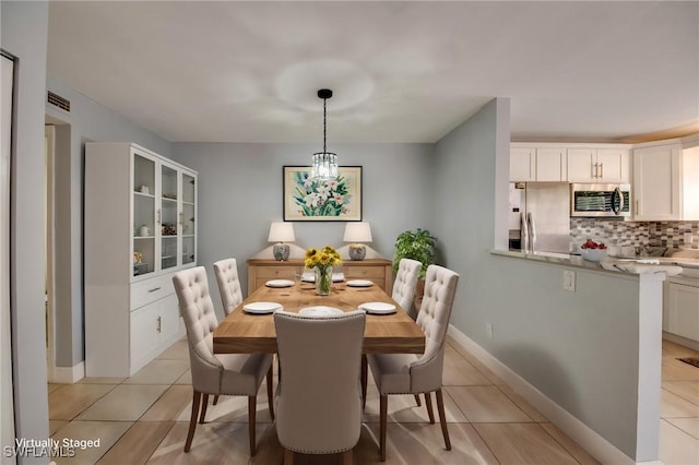 1464 Park Shore Cir Unit 2, Fort Myers, FL 33901 - dining area featuring light tile patterned floors and baseboards