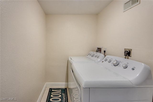 1464 Park Shore Cir Unit 2, Fort Myers, FL 33901 - laundry room featuring independent washer and dryer and baseboards