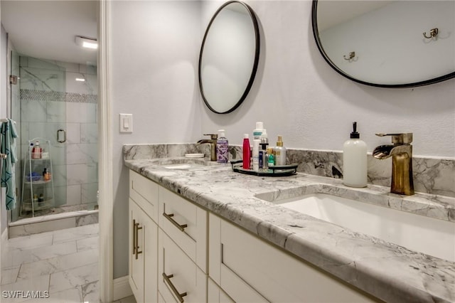 1464 Park Shore Cir Unit 2, Fort Myers, FL 33901 - bathroom featuring marble finish floors, double vanity, and a shower stall
