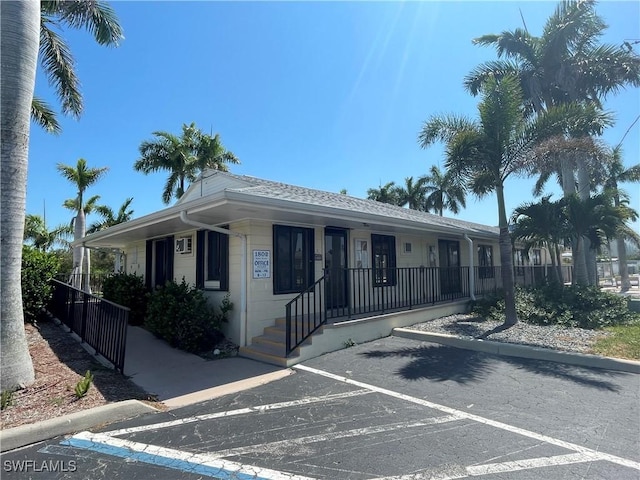 99 Blackbeard Way, Fort Myers Beach, FL 33931 - ranch-style house featuring uncovered parking and a porch