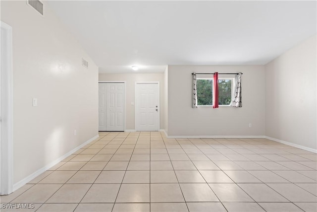 209 Meadow Rd, Lehigh Acres, FL 33973 - spare room with baseboards and light tile patterned floors