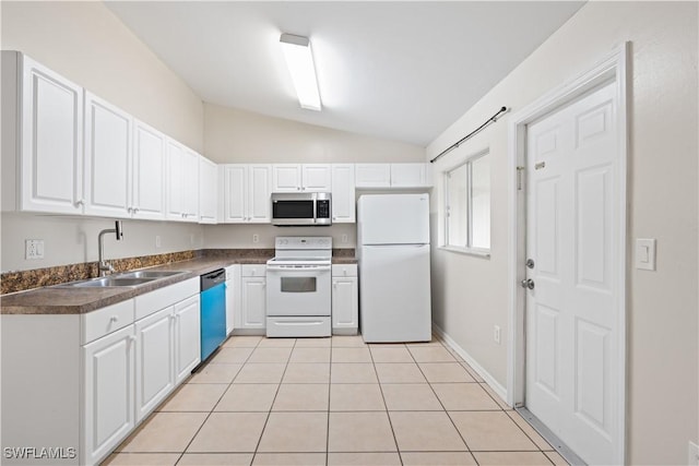 209 Meadow Rd, Lehigh Acres, FL 33973 - kitchen with white appliances, a sink, vaulted ceiling, dark countertops, and white cabinets