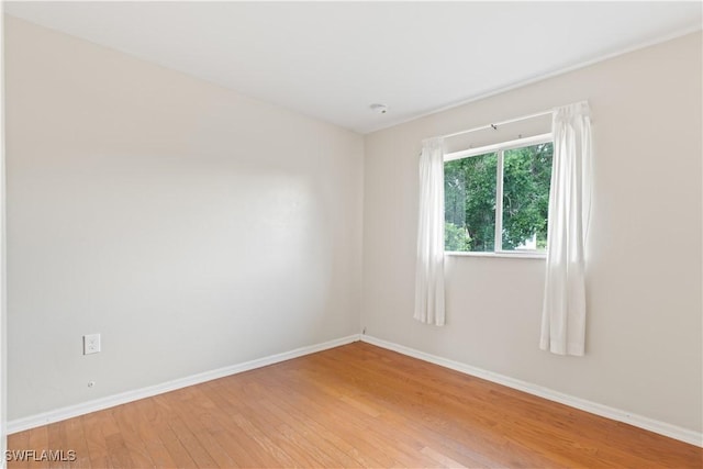 209 Meadow Rd, Lehigh Acres, FL 33973 - unfurnished room with light wood-style floors and baseboards