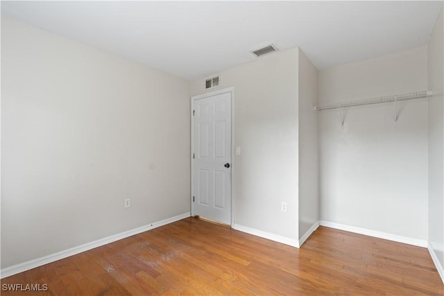 209 Meadow Rd, Lehigh Acres, FL 33973 - unfurnished bedroom featuring light wood-style floors, baseboards, and a closet