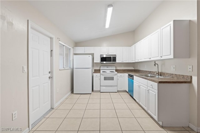 209 Meadow Rd, Lehigh Acres, FL 33973 - kitchen featuring white appliances, a sink, dark countertops, lofted ceiling, and white cabinets