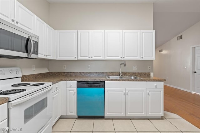 209 Meadow Rd, Lehigh Acres, FL 33973 - kitchen featuring dishwashing machine, electric range, stainless steel microwave, a sink, and white cabinetry