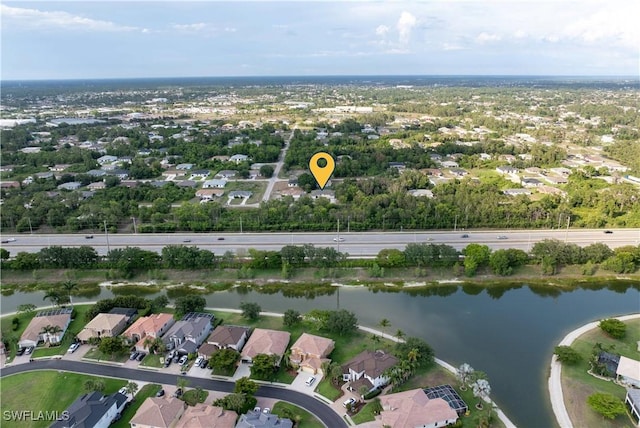 209 Meadow Rd, Lehigh Acres, FL 33973 - aerial overview of property's location with a large body of water and nearby suburban area