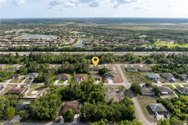 209 Meadow Rd, Lehigh Acres, FL 33973 - aerial view of property and surrounding area with nearby suburban area and a nearby body of water
