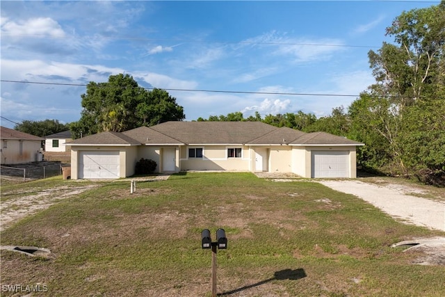 209 Meadow Rd, Lehigh Acres, FL 33973 - single story home with dirt driveway, a garage, a front lawn, and stucco siding