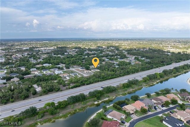209 Meadow Rd, Lehigh Acres, FL 33973 - aerial overview of property's location with a nearby body of water and nearby suburban area