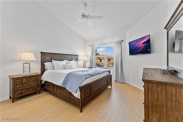 20051 Seagrove St Unit 1206, Estero, FL 33928 - bedroom with light wood-style floors, baseboards, lofted ceiling, and a ceiling fan