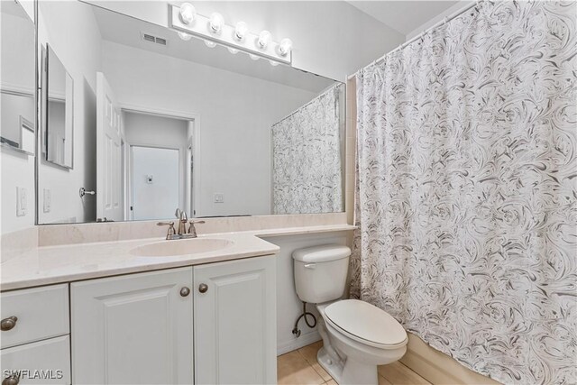 20051 Seagrove St Unit 1206, Estero, FL 33928 - bathroom featuring toilet, tile patterned flooring, vanity, and curtained shower