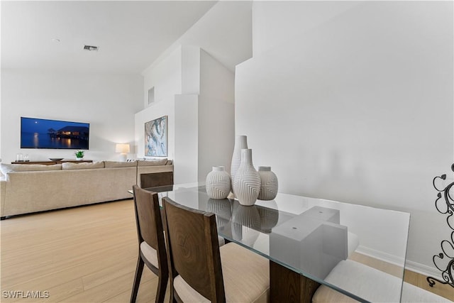 20051 Seagrove St Unit 1206, Estero, FL 33928 - dining space with wood finished floors and baseboards