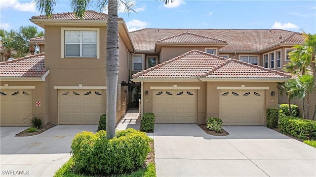 20051 Seagrove St Unit 1206, Estero, FL 33928 - townhome / multi-family property featuring a tiled roof, stucco siding, and concrete driveway