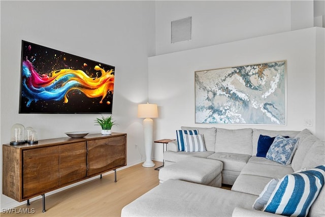 20051 Seagrove St Unit 1206, Estero, FL 33928 - living area featuring wood finished floors and a towering ceiling