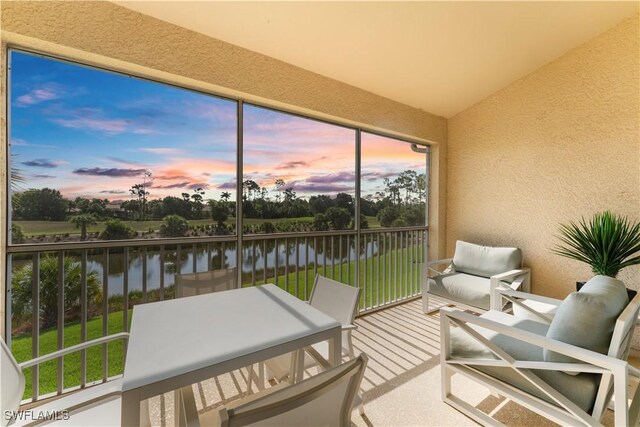20051 Seagrove St Unit 1206, Estero, FL 33928 - sunroom featuring a water view and vaulted ceiling